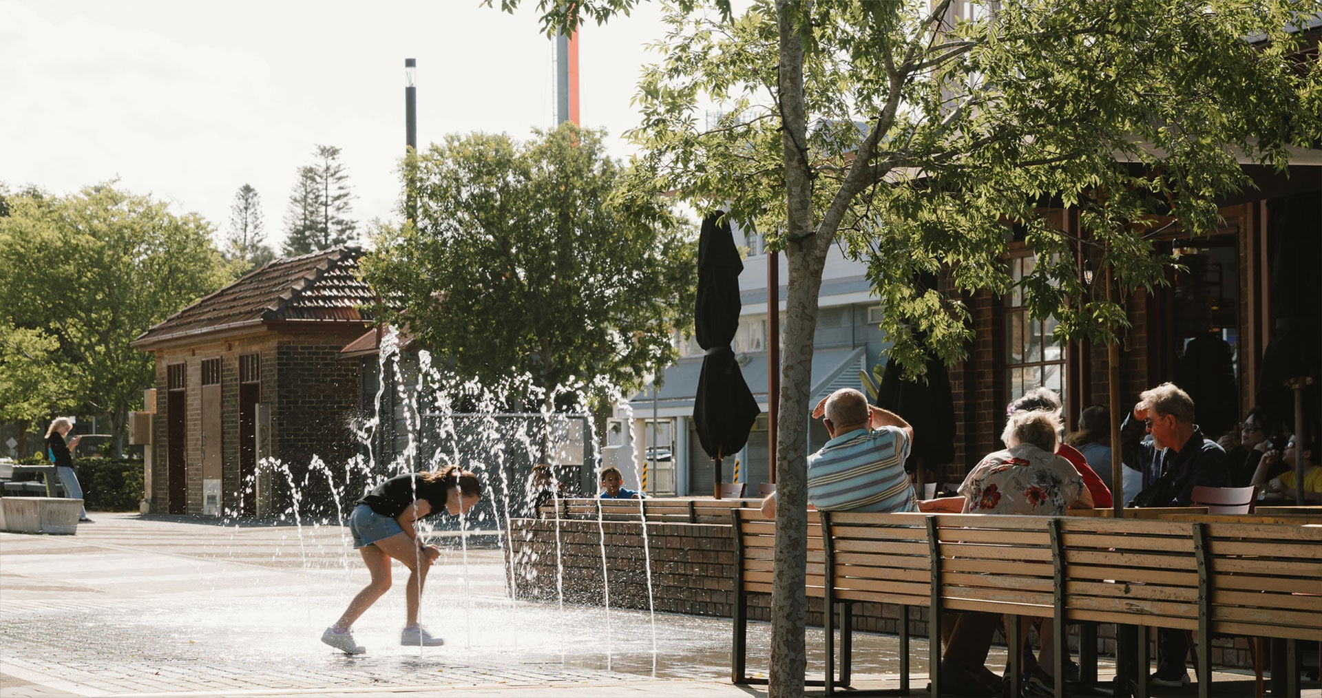 GWH_Era_Location_Image_girl_playing_with_fountain_1920x1014-min